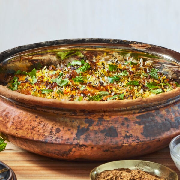 A metal pot of chicken biryani.