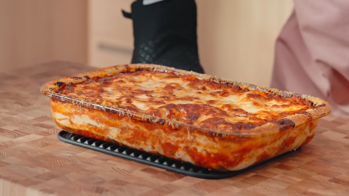 A glass dish of baked lasagna.