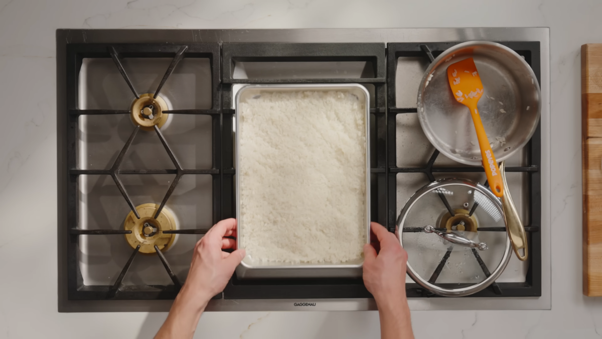 Rice on a baking sheet.