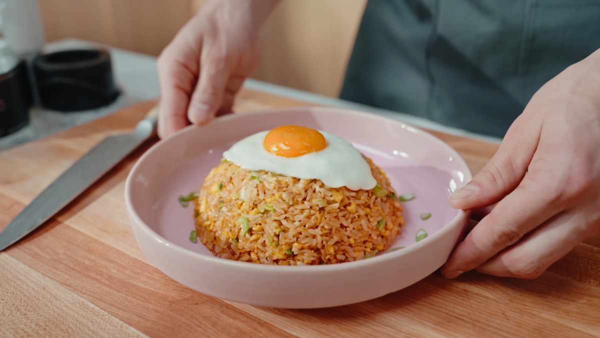 A ball of fried rice with an egg on top.