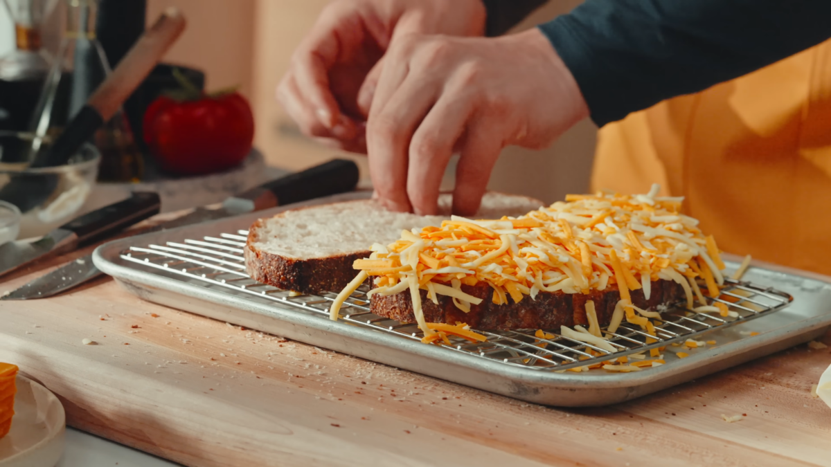 Sourdough bread with fresh grated cheese on top.