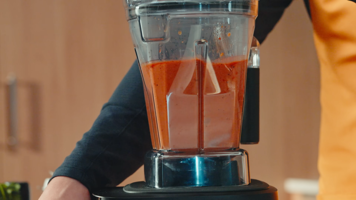 Tomato soup blending in a blender.