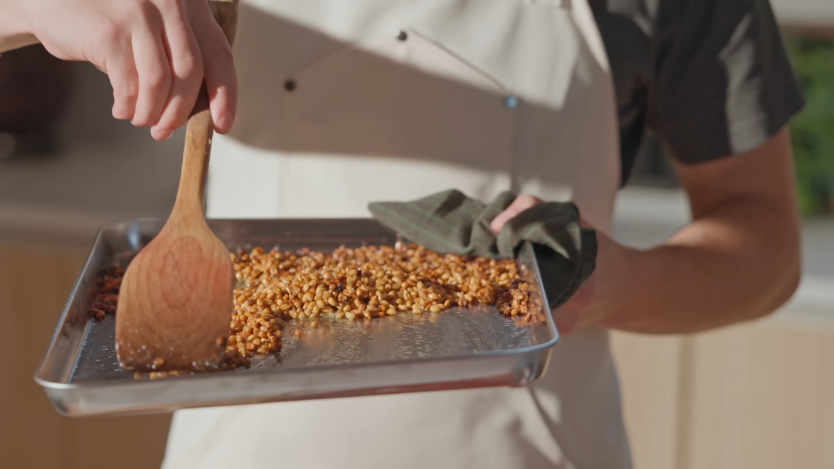 Baked Farro grain on a baking sheet.