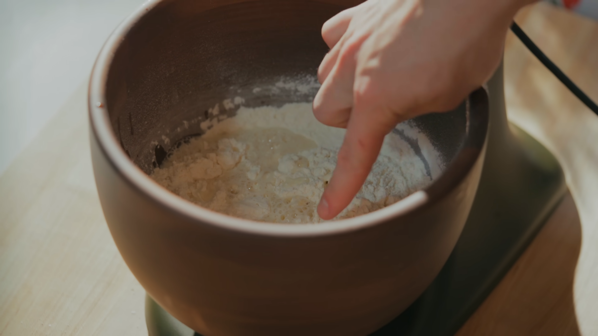 Flour and water in a large mixing bowl.