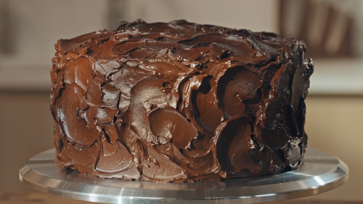 A chocolate cake covered in chocolate frosting.