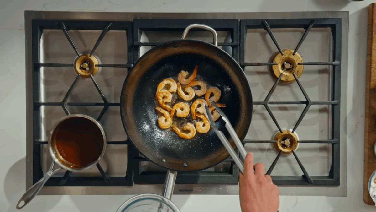 Shrimp cooking in a wok.