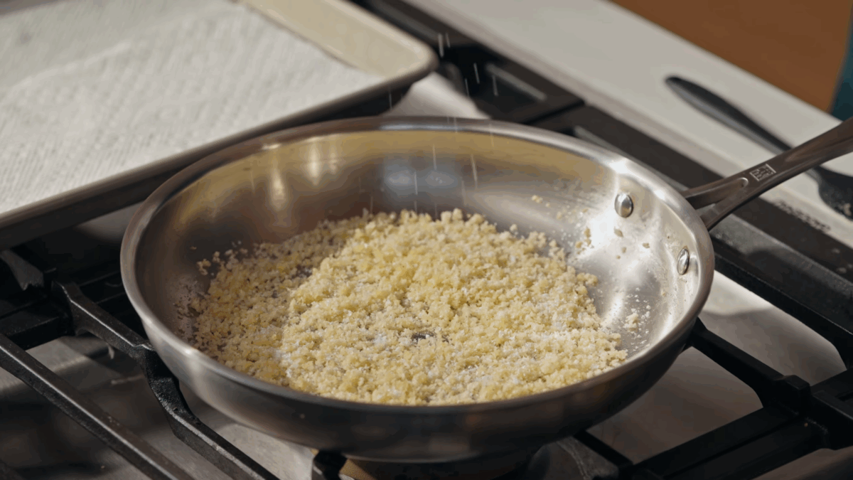Breadcrumbs toasting in a skillet. 