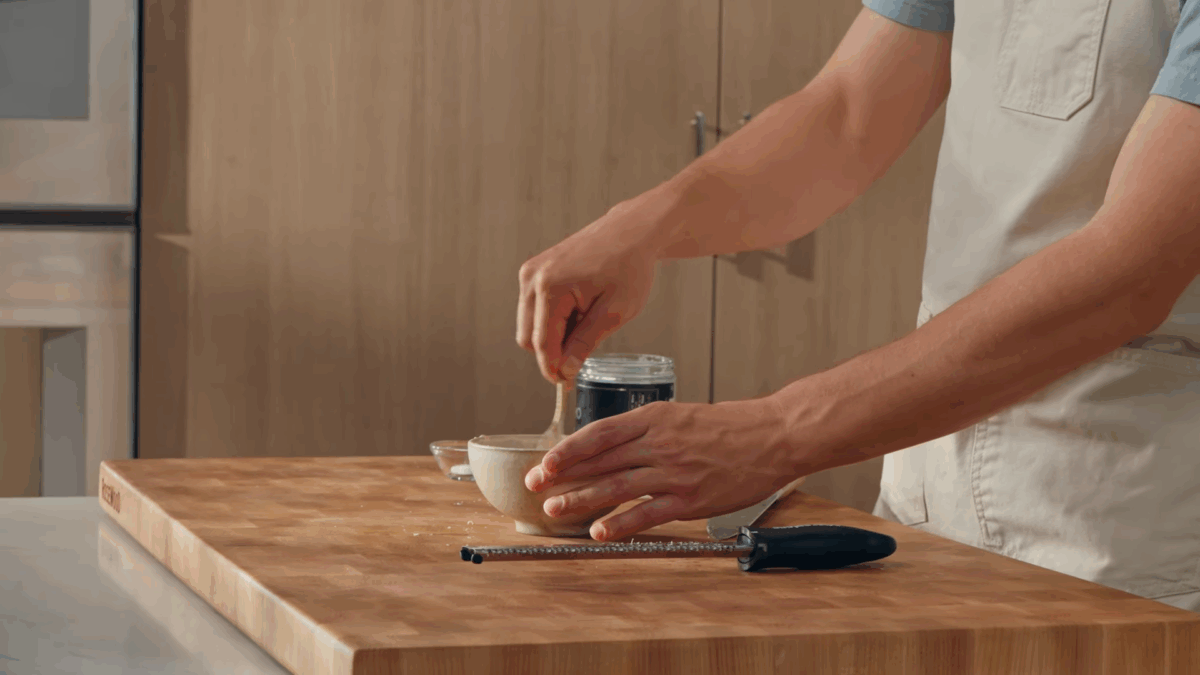 Chipotle sauce being whisked in a bowl. 