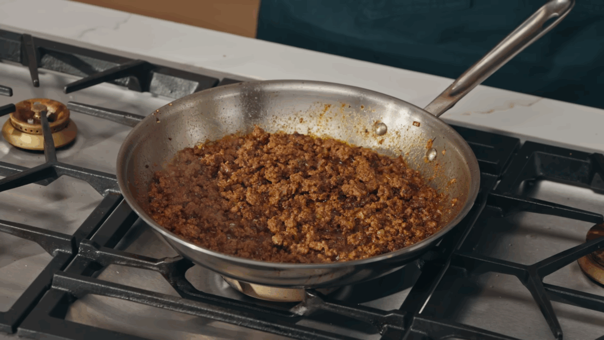 Seasoned taco meat in a skillet. 