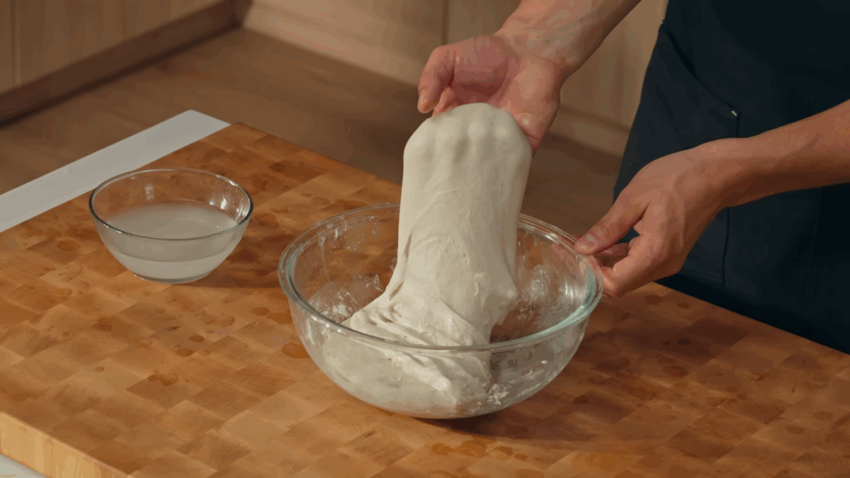 Nick DiGiovanni folding sourdough bread dough.