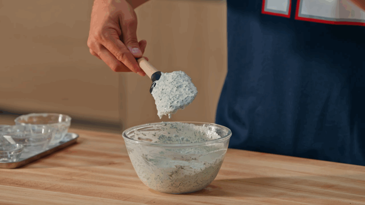 Nick DiGiovanni stirring homemade ranch dressing. 