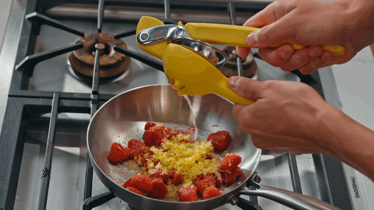 Nick DiGiovanni combining ingredients for a raspberry coulis.
