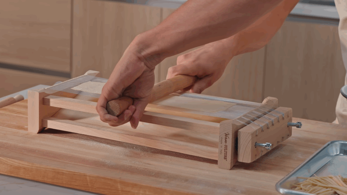Nick DiGiovanni cutting pasta dough into spaghetti for carbonara.