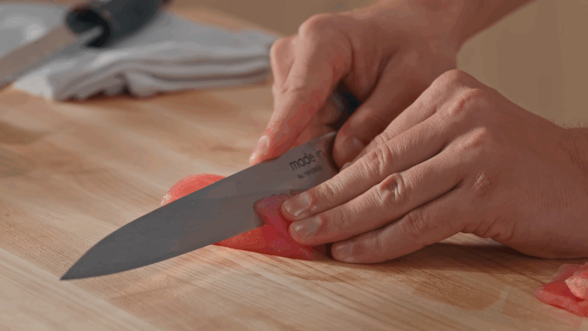 Nick DiGiovanni slicing sushi grade fish.