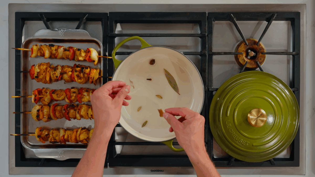 Nick DiGiovanni sautéing aromatics for tikka masala sauce.