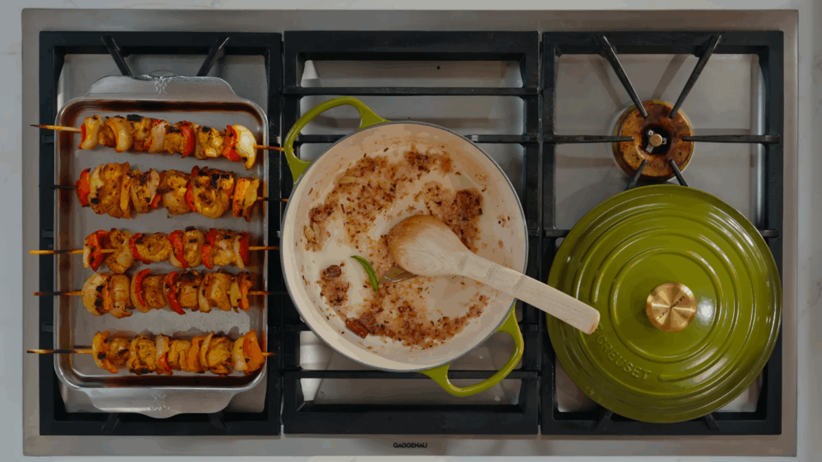 Spices and aromatics sautéing in a Dutch oven.