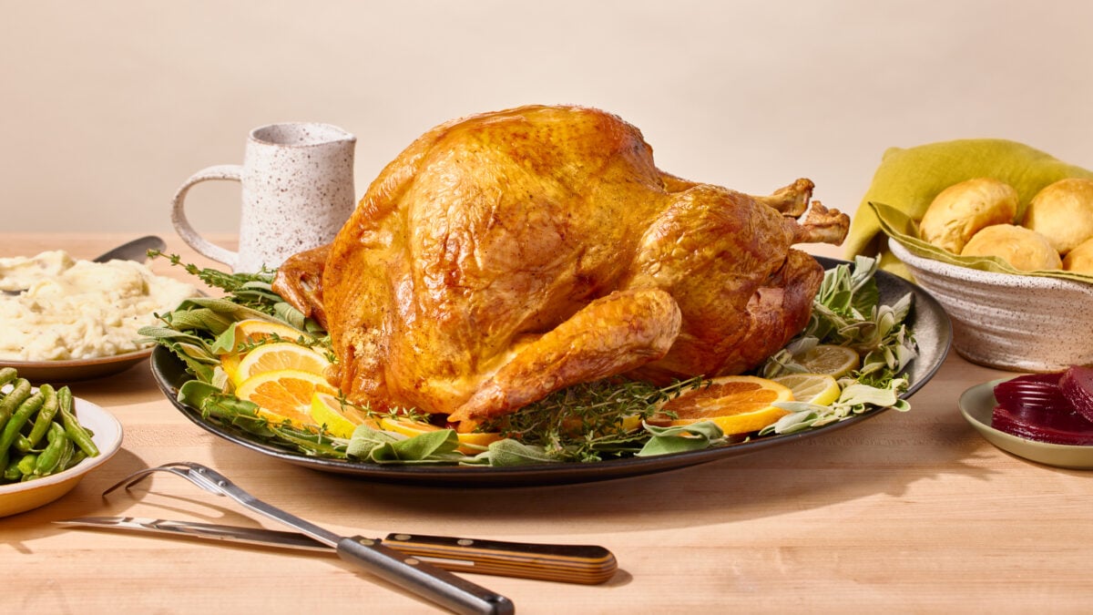 A roasted spatchcock turkey on a platter.