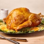 A roasted spatchcock turkey on a platter.