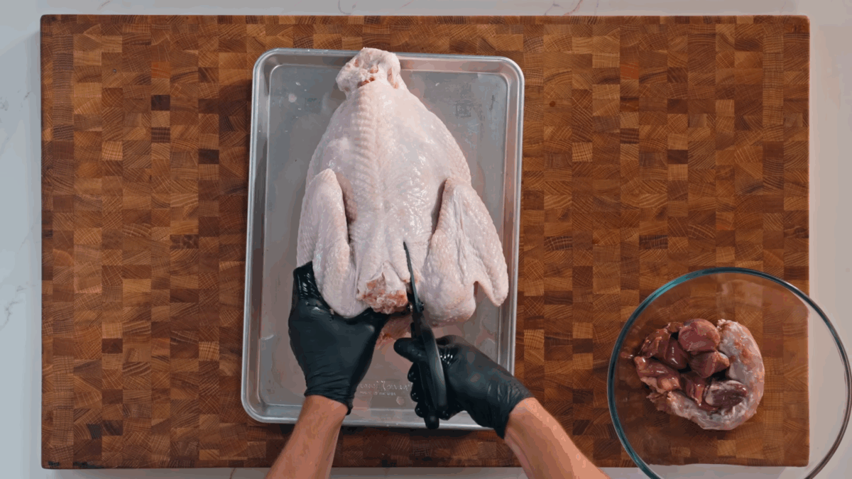 Nick DiGiovanni taking the spine out of a Thanksgiving turkey. 