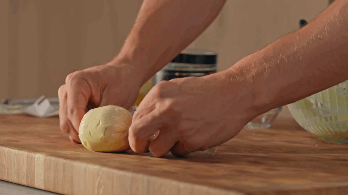 Nick DiGiovanni rolling compound butter in plastic wrap. 