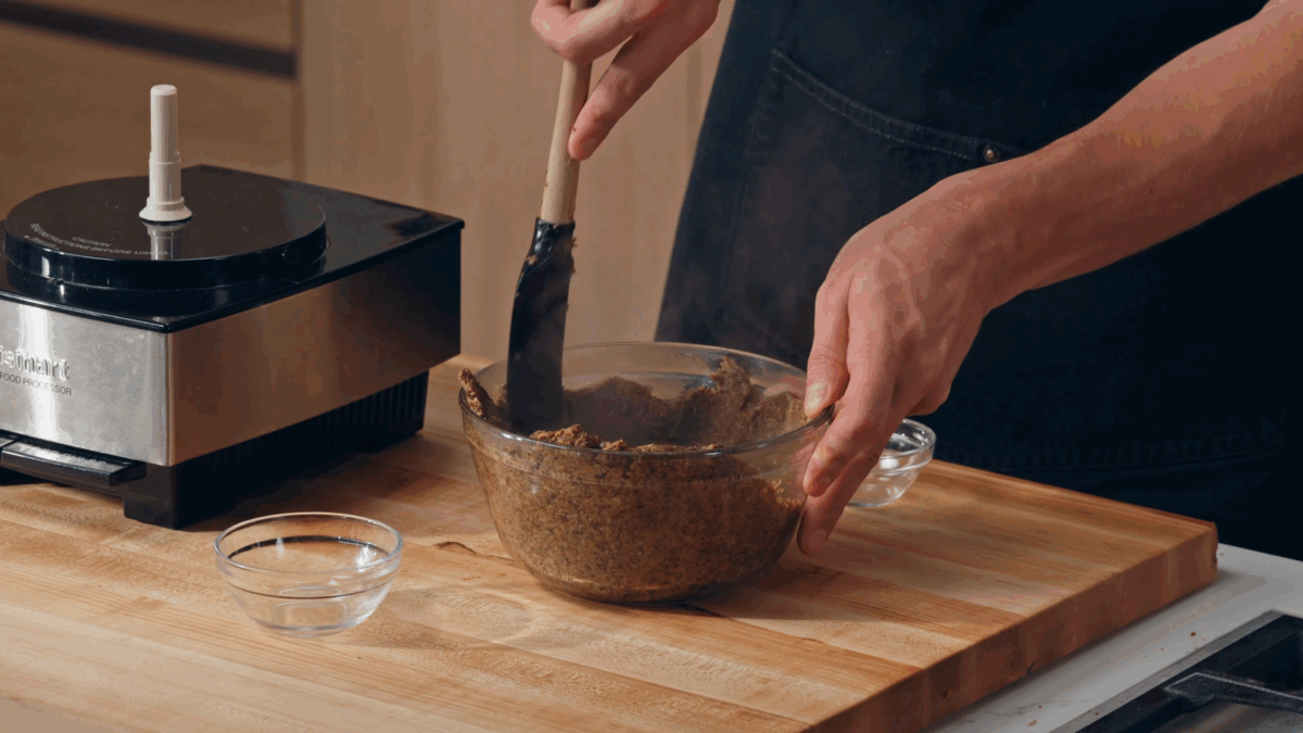 Nick DiGiovanni spreading a duxelles mixture in a bowl. 