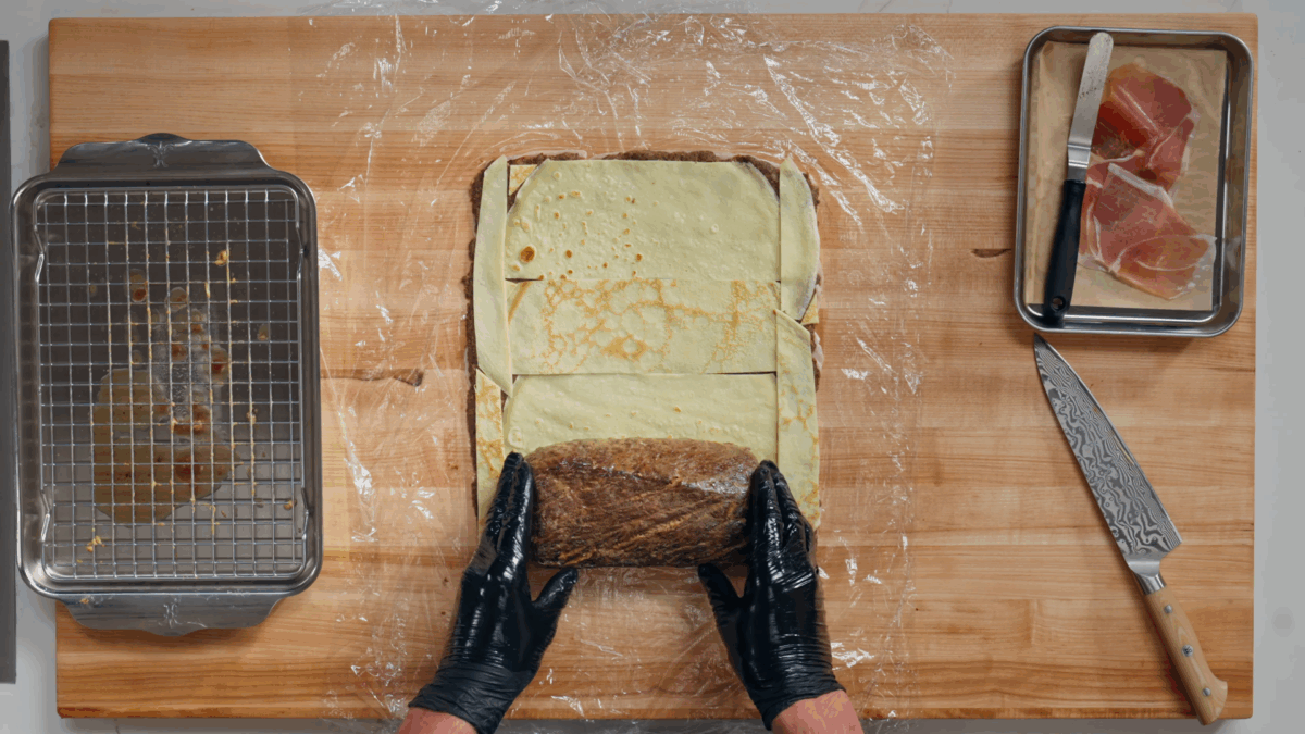 Nick DiGiovanni wrapping a Beef Wellington. 