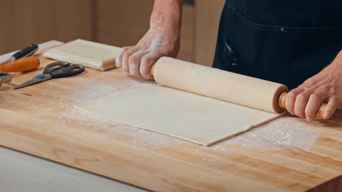 Nick DiGiovanni rolling pastry dough. 