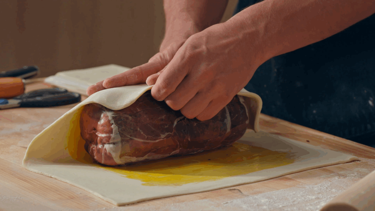 Nick DiGiovanni wrapping a Beef Wellington in dough. 