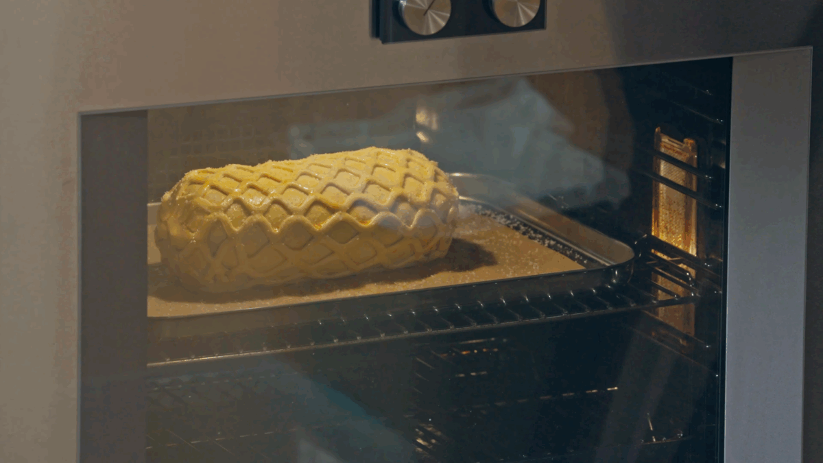 A Beef Wellington baking in an oven. 