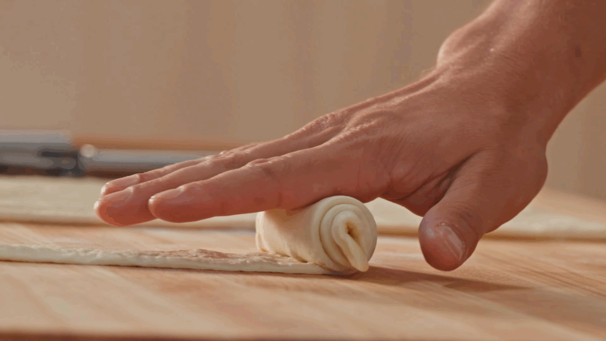 Nick DiGiovanni rolling homemade croissant dough. 