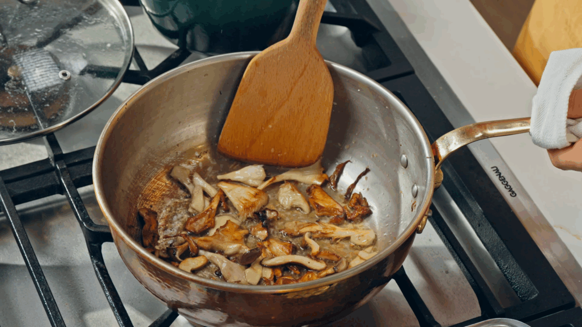 Nick DiGiovanni cooking crispy mushrooms in a skillet.