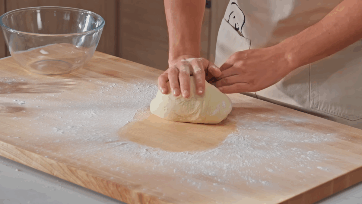 Nick DiGiovanni kneading yeast donut dough. 