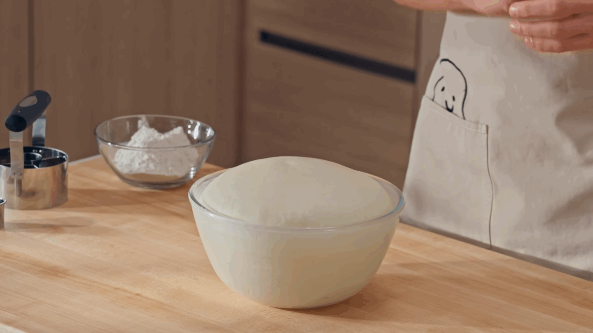 A bowl of proofed yeast donut dough. 