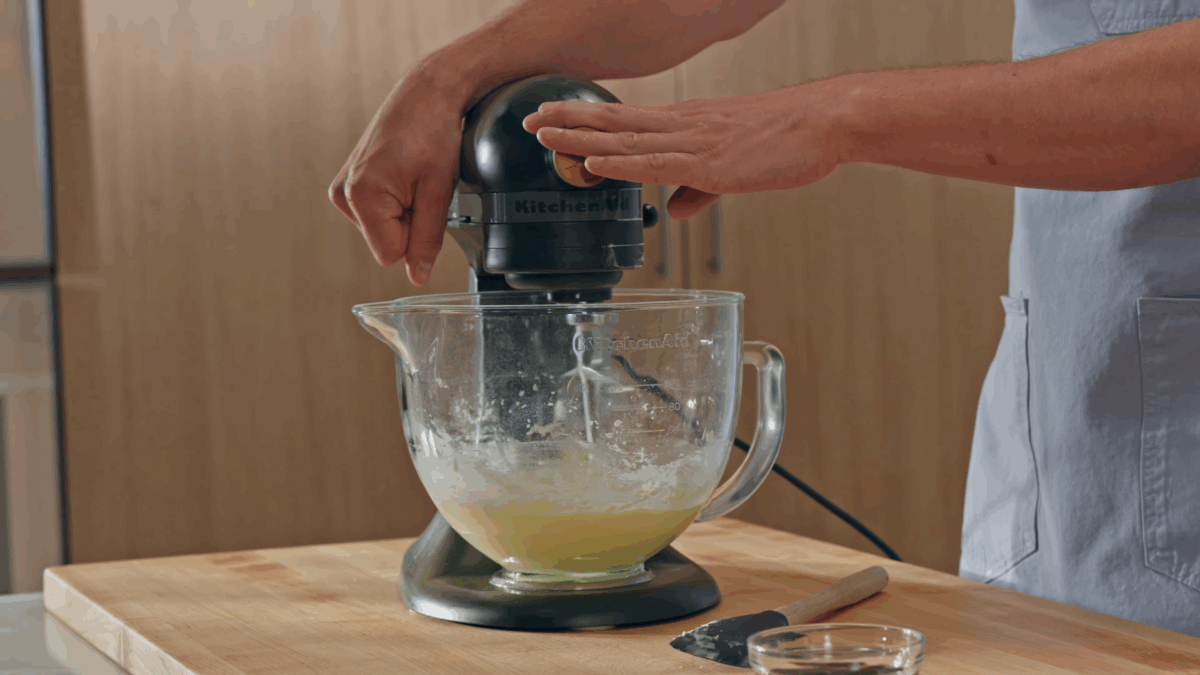 Nick DiGiovanni combining buttercream ingredients in a stand mixer. 