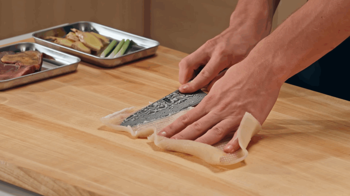 Nick DiGiovanni trimming pork skin. 