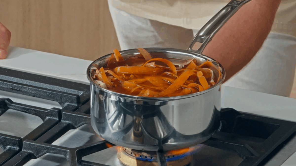 Nick DiGiovanni simmering veggie scraps and stock in a pot.