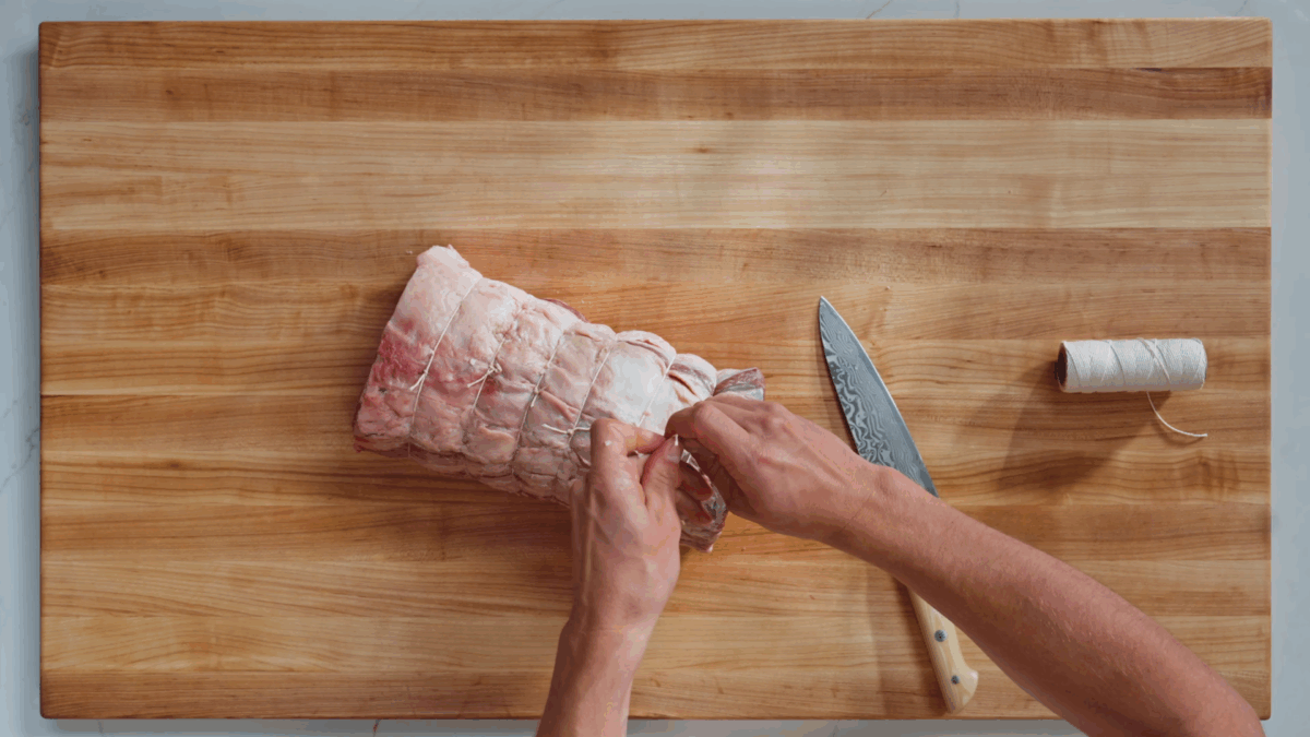 Nick DiGiovanni wrapping a prime rib roast with butcher's twine.
