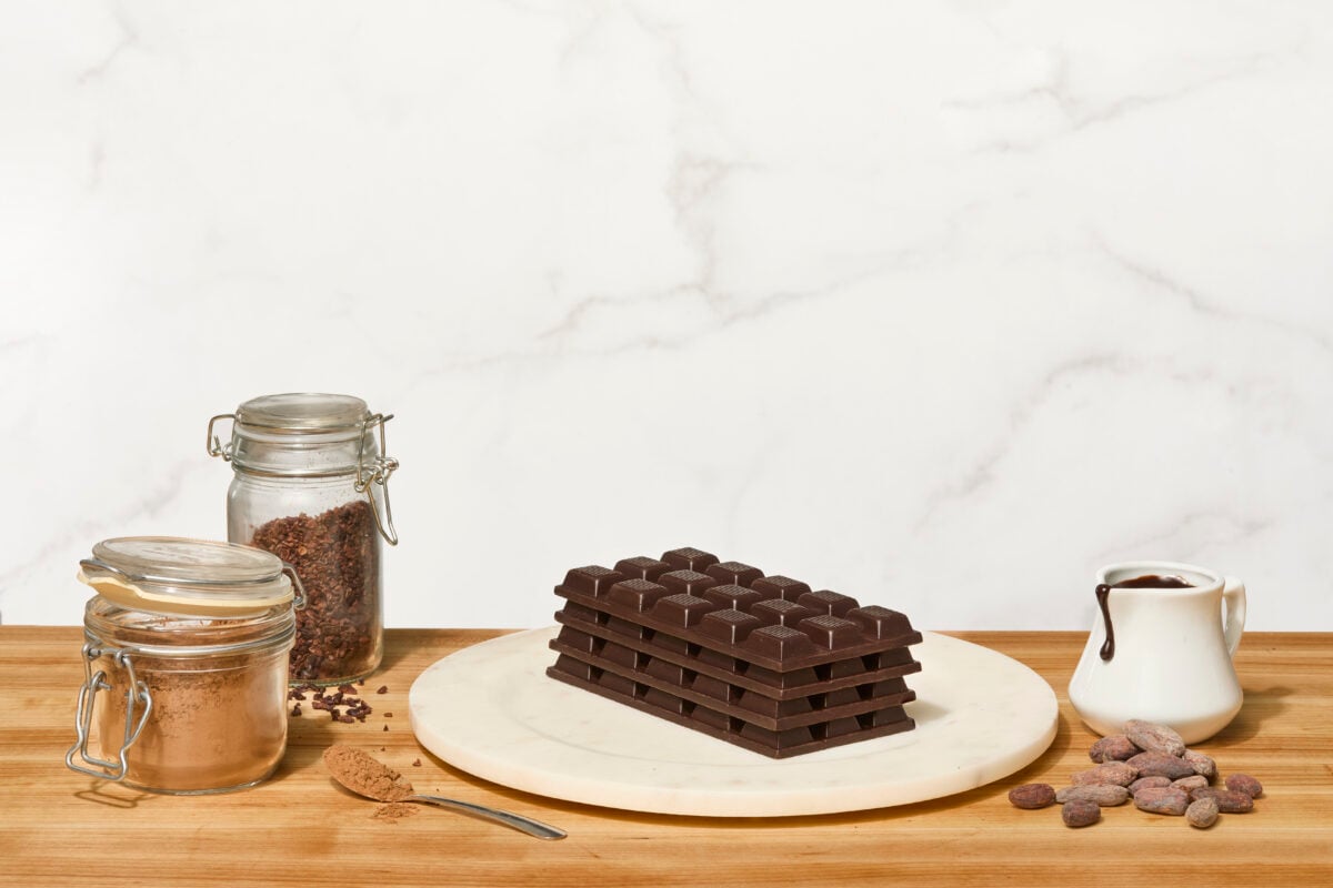 Homemade chocolate bars stacked on a plate.
