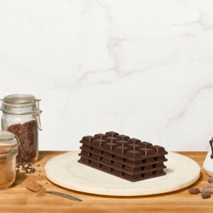 Homemade chocolate bars stacked on a plate.