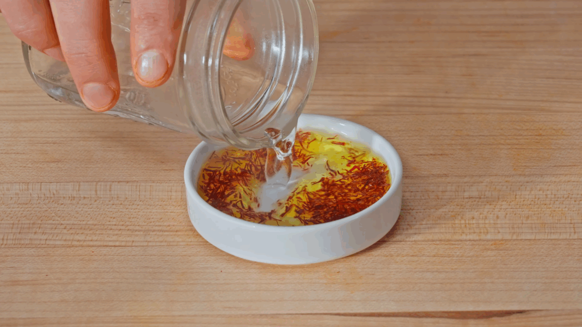 Nick DiGiovanni blooming saffron threads with seafood stock.