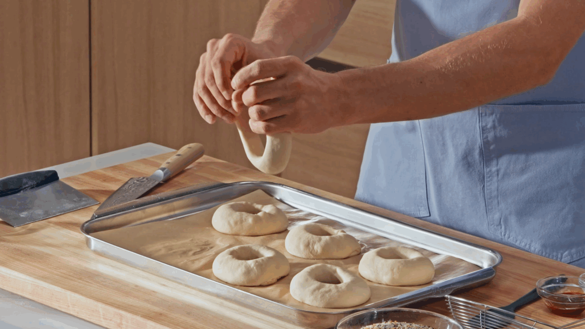 Nick DiGiovanni shaping raw bagels. 