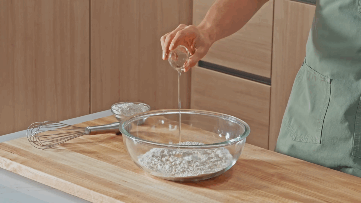 Nick DiGiovanni combining naan ingredients in a bowl. 