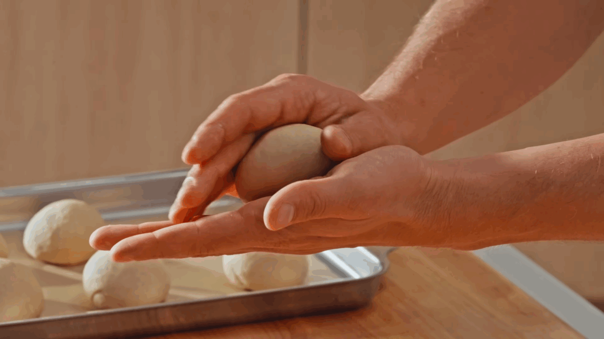 Nick DiGiovanni shaping naan dough. 