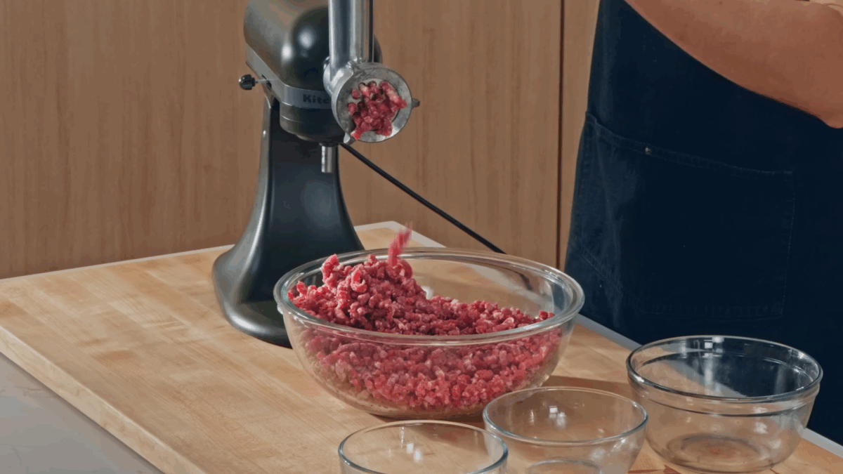 Nick DiGiovanni grinding meat in a stand mixer.