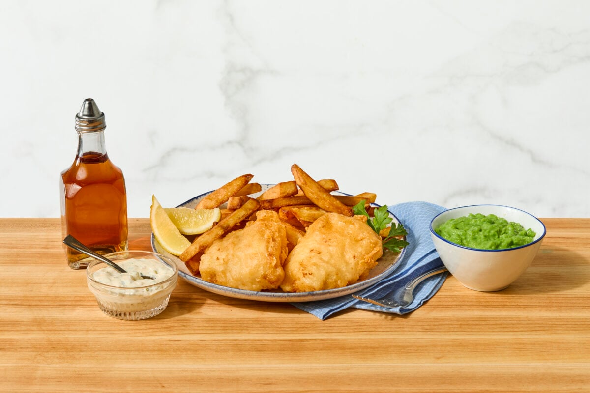 A platter of beer battered fish and chips.
