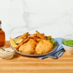 A platter of beer battered fish and chips.