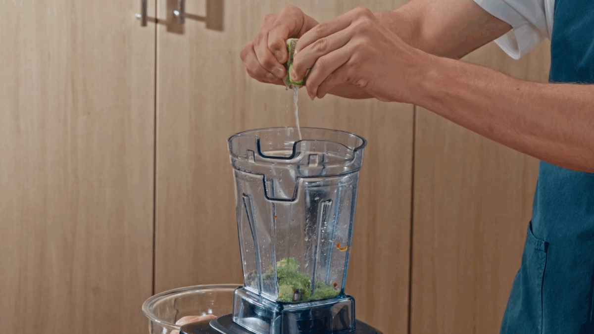 Nick DiGiovanni combining pollo asado marinade ingredients in a blender. 