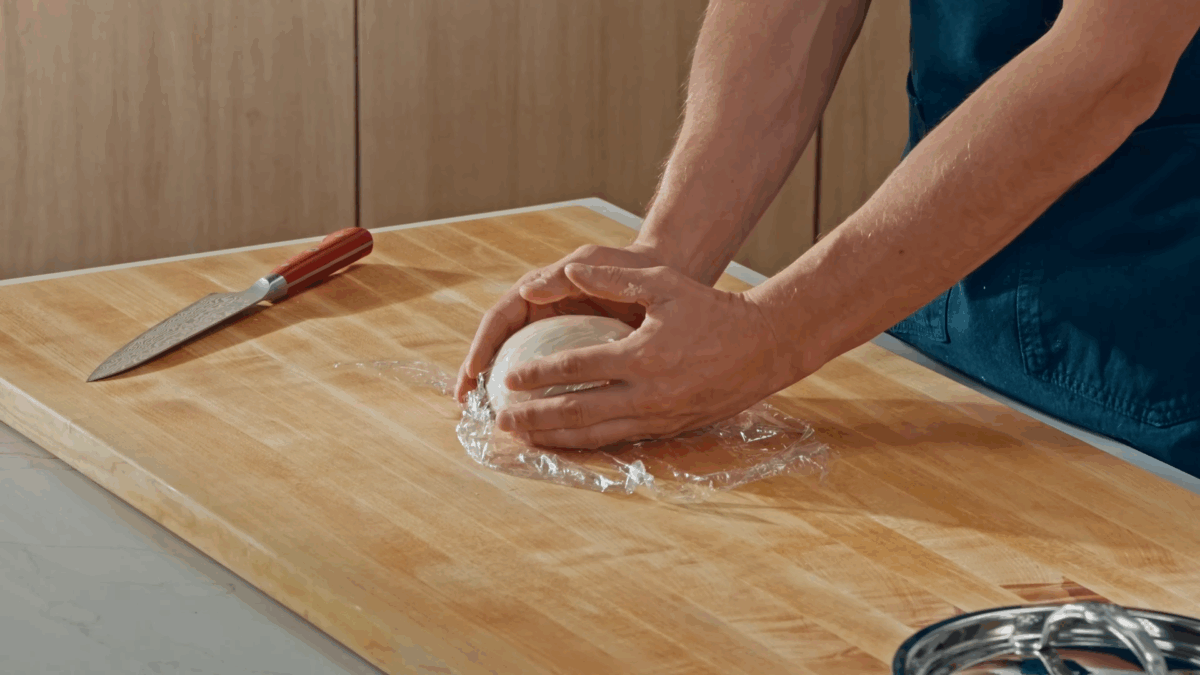 Nick DiGiovanni rolling tortilla dough into a ball. 