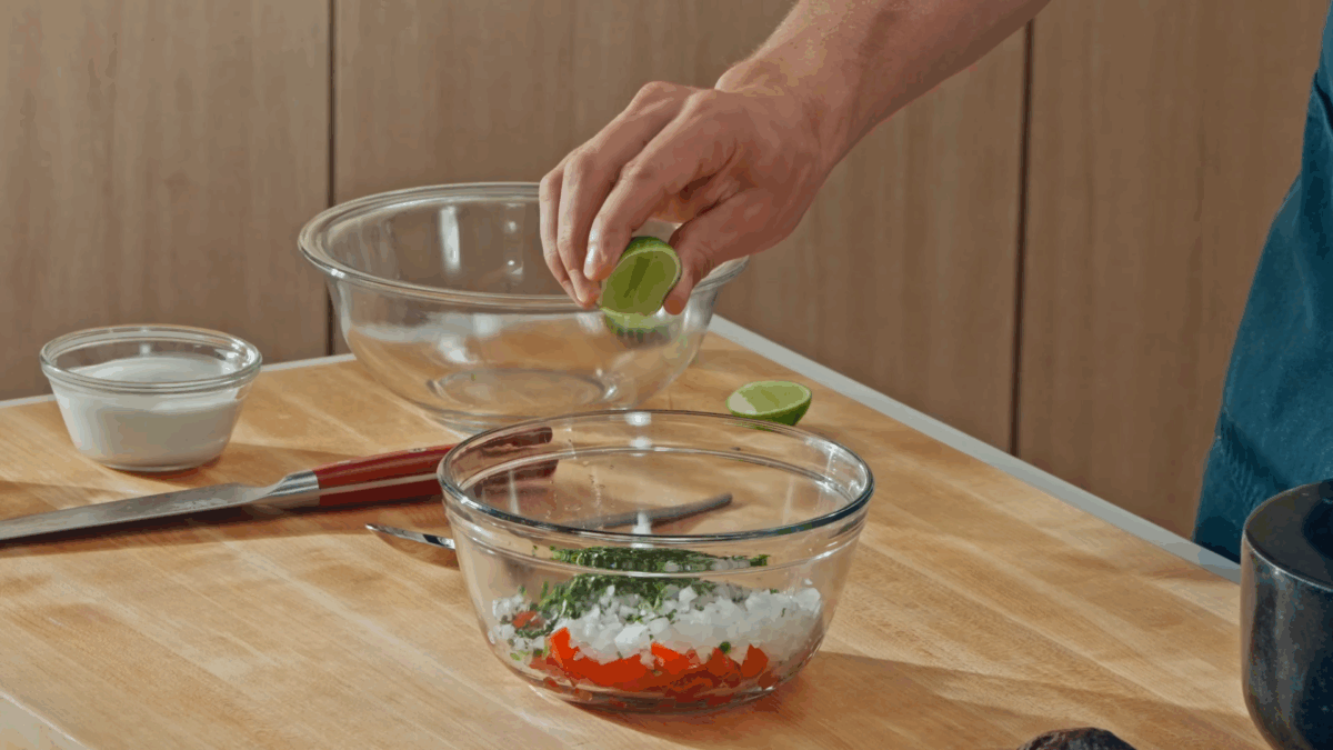 Nick DiGiovanni combining pico de gallo ingredients. 