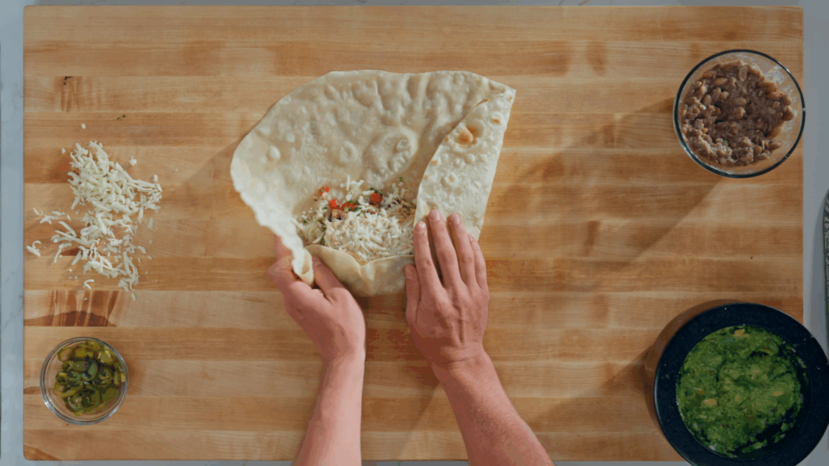 Nick DiGiovanni wrapping a chicken burrito. 